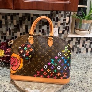Customized monogram alma rare find. USED in excellent condition. GENUINE!